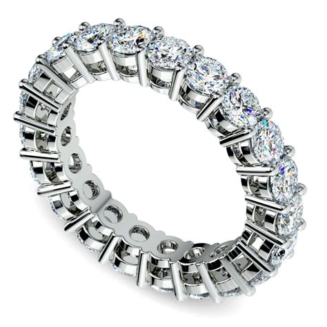 Infinity band - Lace Pave Infinity Band. Two rows of natural diamond pavé twist together forming this beautiful, lacy infinity band. Crafted in bright 14-karat white gold, it makes a gorgeous wedding band, anniversary gift, or daily accessory. 42 round natural diamonds at approx. 0.20 tcw. Infinity design.